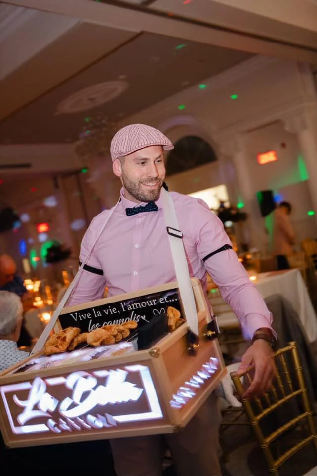 La Bella Cannoli serving fresh handcrafted cannoli at your event with our roaming cannoli service